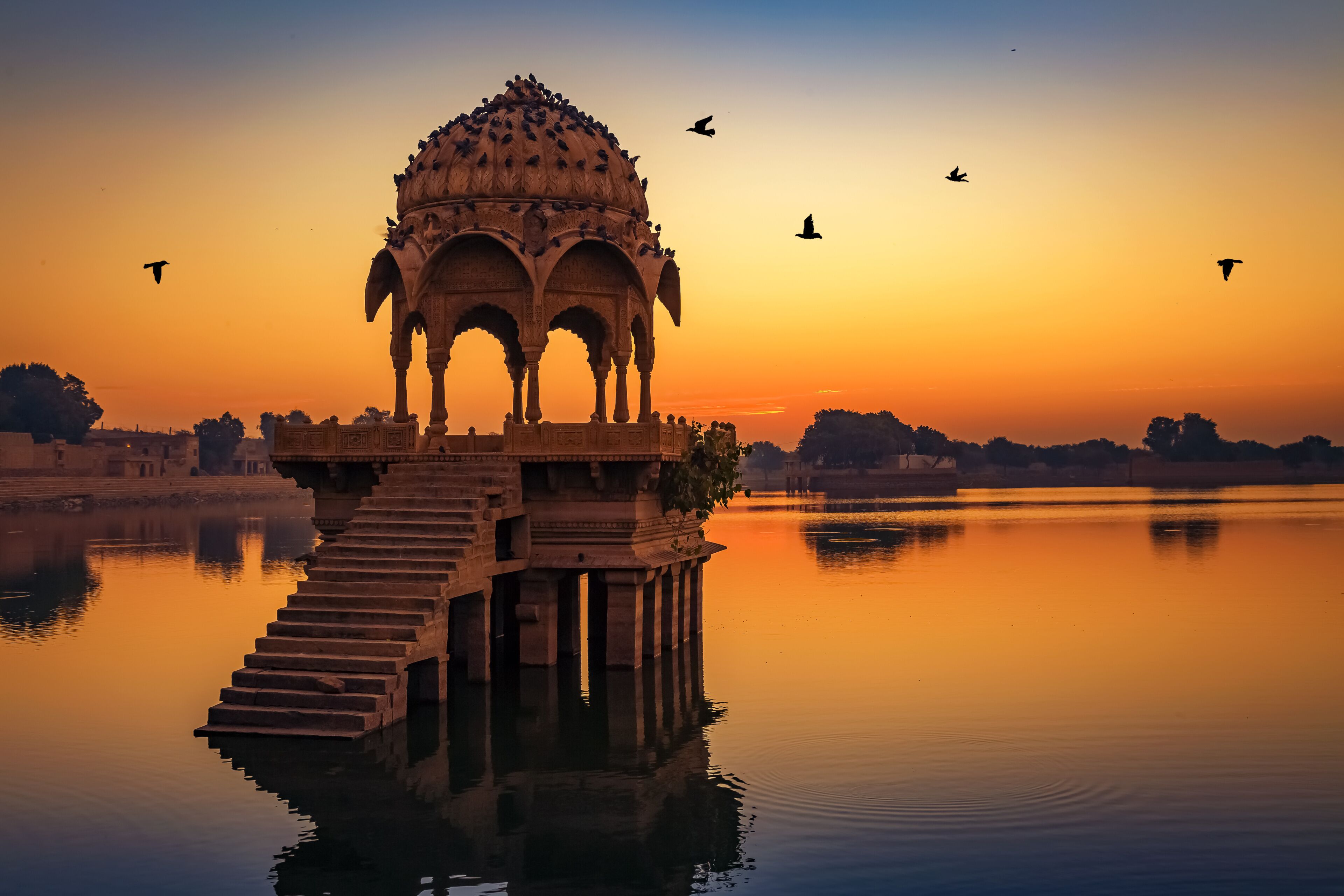 Ancient temple at Gadi Sagar (Gadisar) lake Jaisalmer Rajasthan, India at dawn.