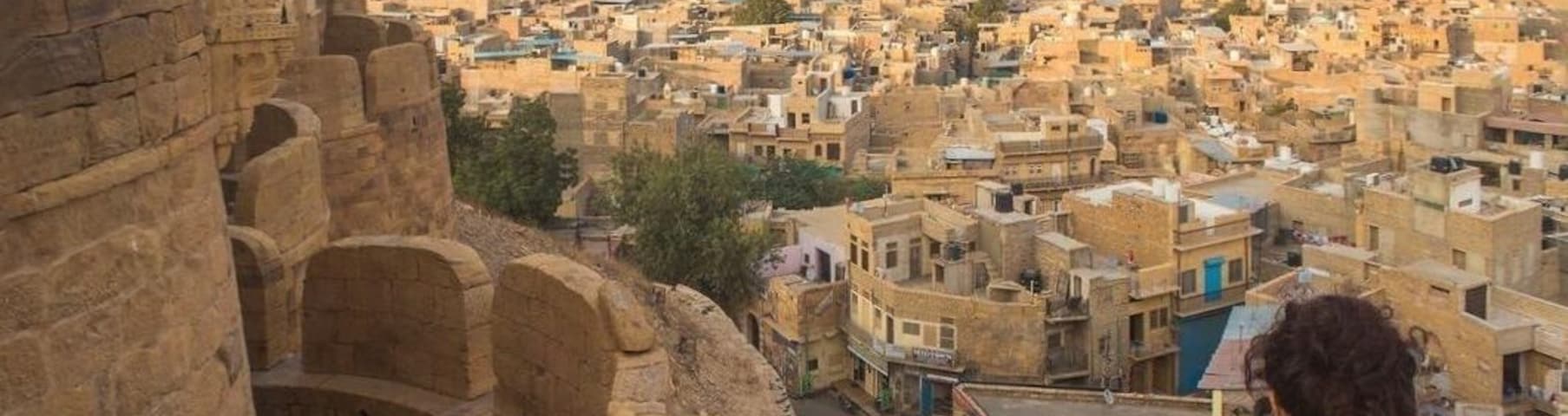 What might be this exotic city of golden abodes, palaces and mansions, blending into the shifting sands of the desert that surrounds it, and stretching as far the eye can see towards the distant horizon?
Why of course, it’s Jaisalmer, a city that is almost engulfed by the Thar desert and positioned at the western frontier of India near the border with Pakistan. 🌙
The centrepiece of the city is the spellbinding Jaisalmer fort, known as Sonar Qila (golden fort) which rises out of the desert like a giant sandcastle and is straight out of a storybook. 🏰
The fort surmounts the 80m high Trikuta hill and has 99 bastions and a series of four mighty gates that one passes through on the way to the central courtyard inside the fort. ✨💫
Looking at this image, taken from the large cannon (the biggest and most impressive cannon in the fort) vantage point in the southeast corner of the fort next to the popular Panorama restaurant, you will undoubtedly agree that Jaisalmer’s appellation “the golden city” is apt.
The buildings are constructed from yellow Jurassic sandstone and the facades are rarely painted over with other colours, lending a rich golden hue to the entire city, especially during the "golden hour."
👨👩👦👦Did you know that the golden fort is also a living fort, with a population of 5,000 inhabitants, consisting of 80% Brahmins and 20% Rajputs, and distributed among 500 households?
Inside the fort there are private residences, several temples, shops, souvenir stalls, hotels, guesthouses, restaurants and palatial buildings.
It is claimed to be the only living fort in India and one of the only living forts in the entire world! 🌏
Are you planning to visit this giant sandcastle in the desert one day?
🐪🌵☀️What is the most spectacular fort you have ever visited?