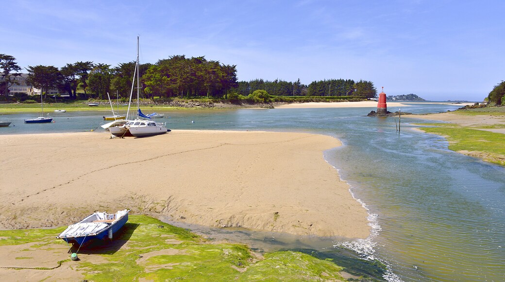 Beach in low tide with boats at Locquirec