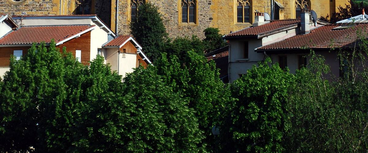 A historic church with a tall bell tower and a clock.