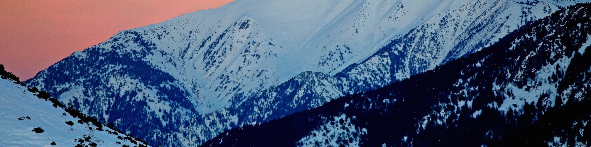 Font-Romeu-Odeillo-Via featuring a sunset, mountains and snow