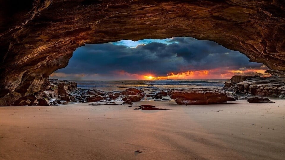 Not the ideal sunrise but definitely dramatic at caves beach sea cave