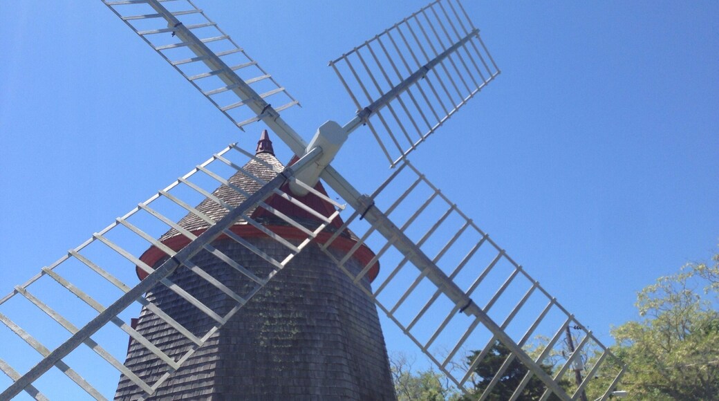 This is the Eastham Windmill in Eastham, MA on Cape Cod. It is the oldest windmill on Cape Cod, built in 1630. Every June there is an art festival held on the green by the windmill.