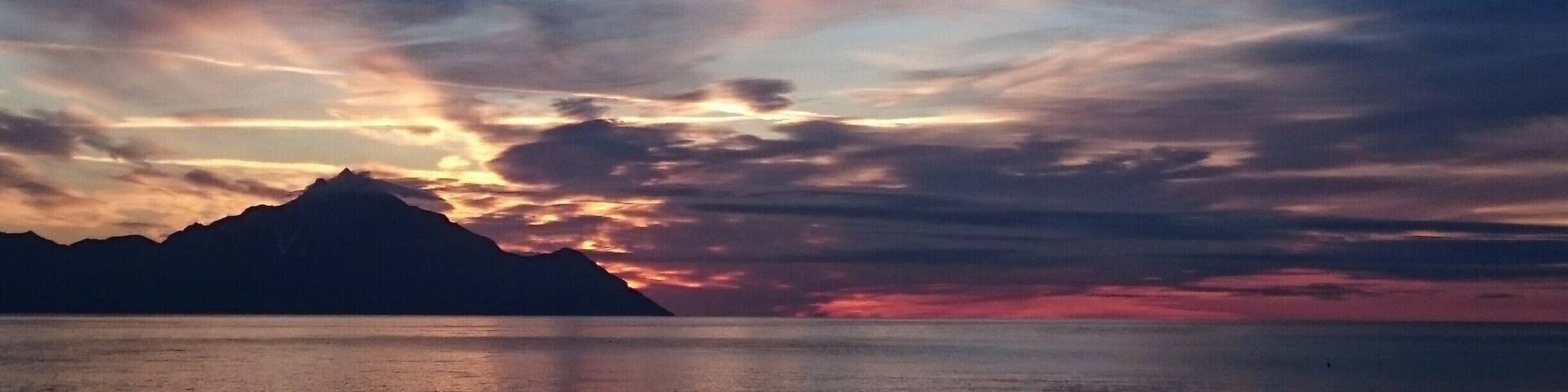 Sunrise from the beach of Sarti, Halkidiki, where you can see mount Athos.
If you come in April, the town is almost desert and you can sleep freely on the beach.