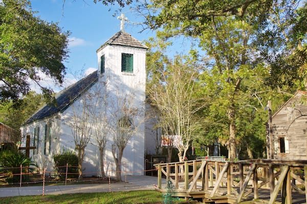 Acadian Village which includes a church or cathedral