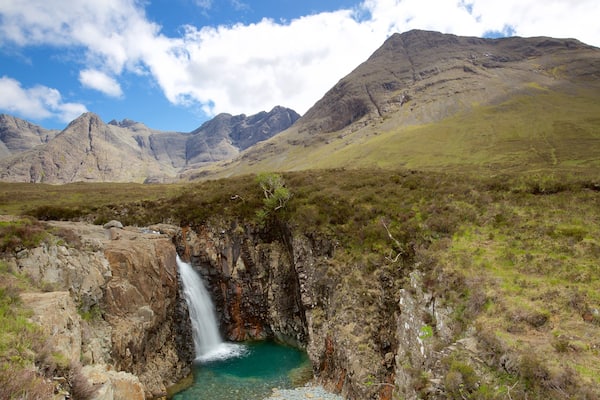 Isle of Skye showing mountains, tranquil scenes and a river or creek