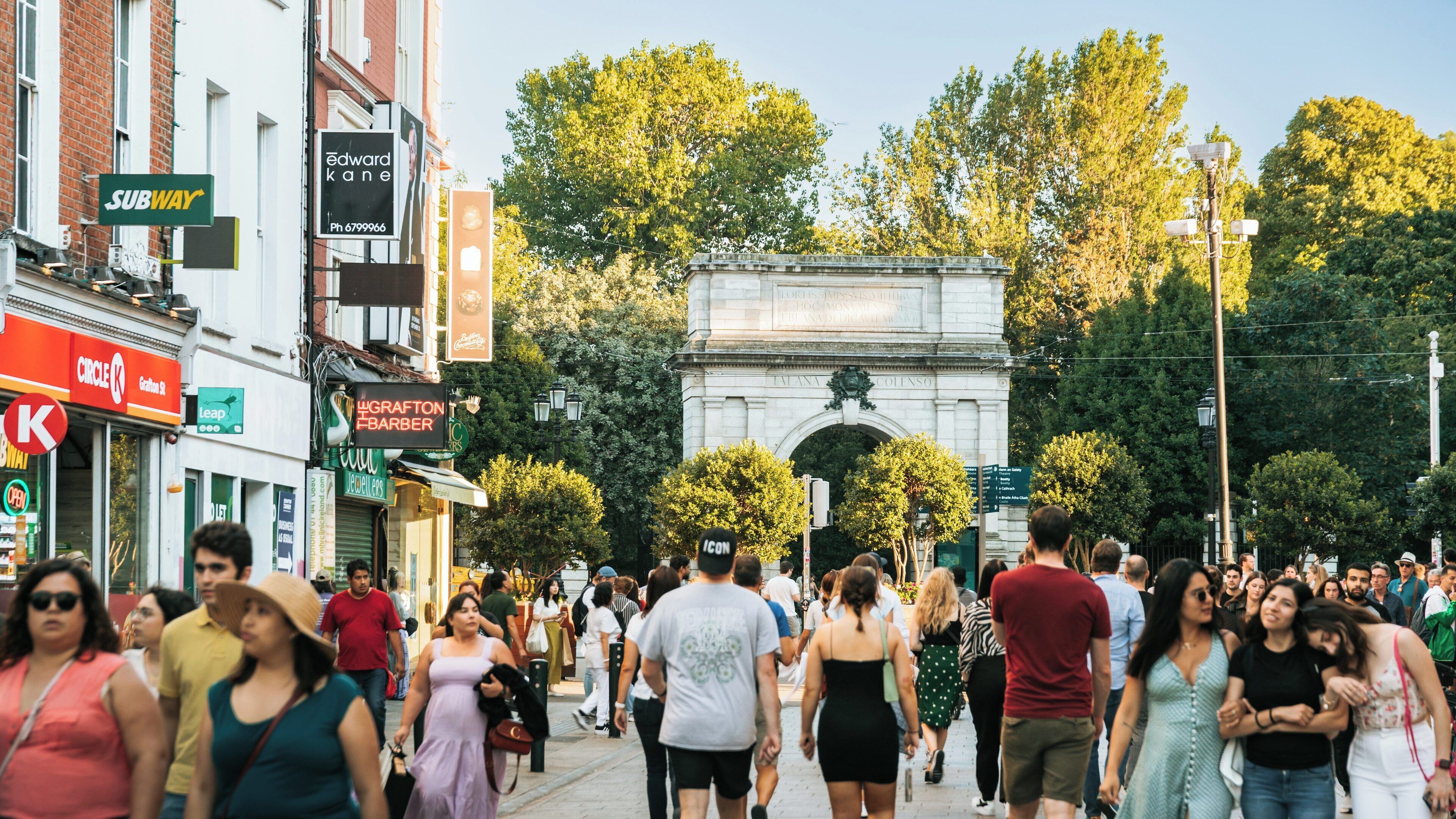 Busy Grafton Street in Dublin showcases vibrant city life and bustling crowds in the heart of Ireland during a sunny afternoon