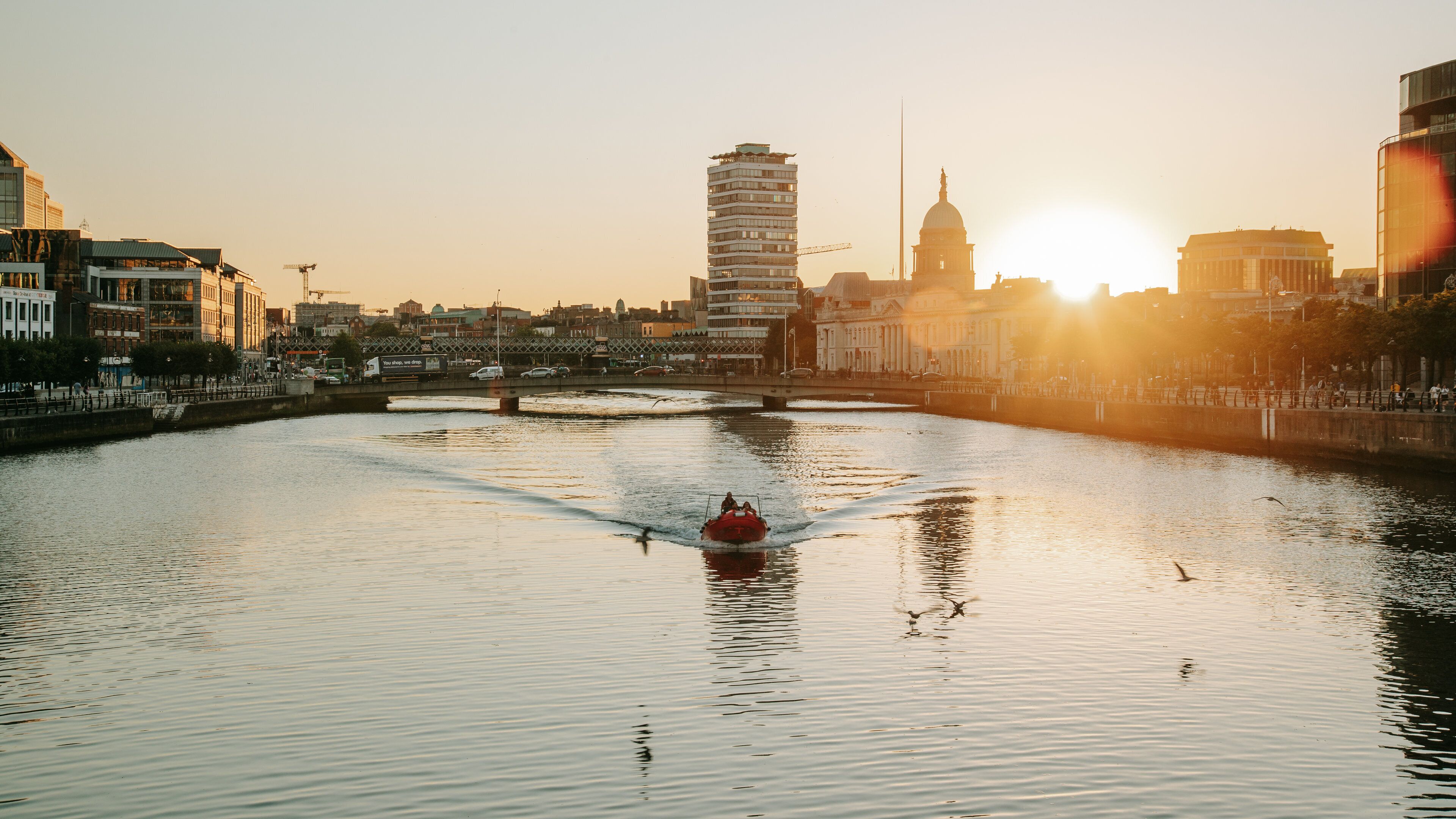 Grafton Street featuring a sunset, boating and a river or creek