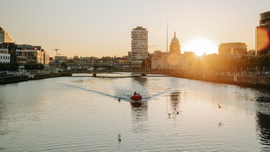 Grafton Street featuring a sunset, boating and a river or creek