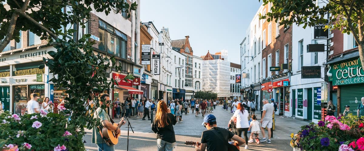 Grafton Street featuring music, street scenes and a city
