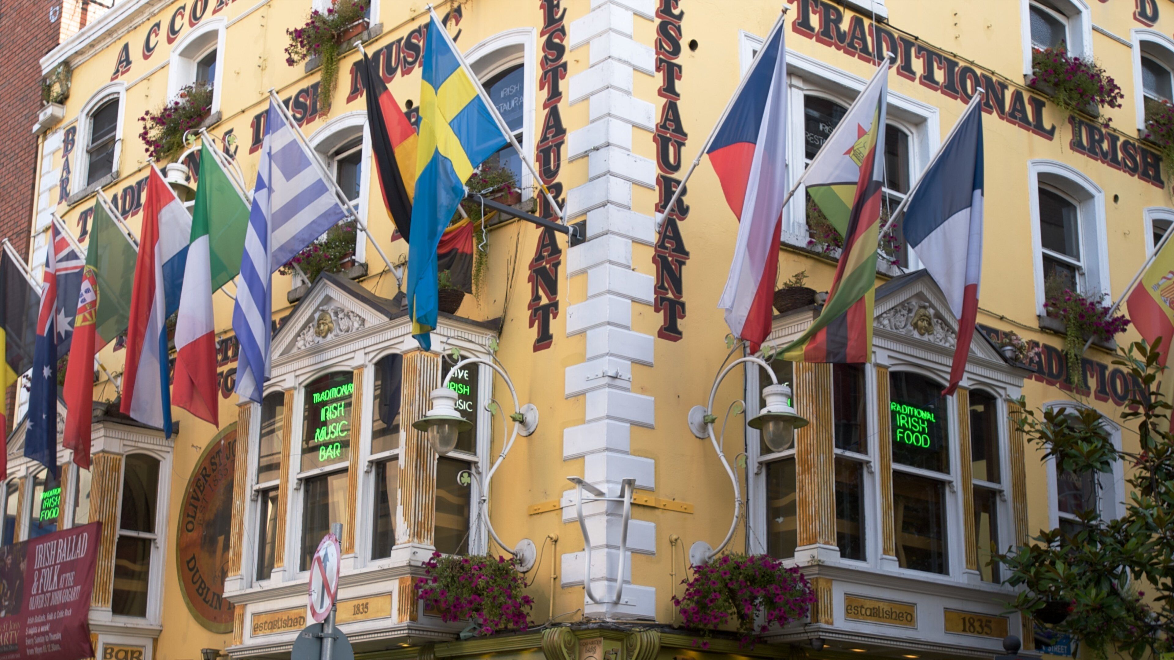 Temple Bar showing signage, a city and heritage architecture