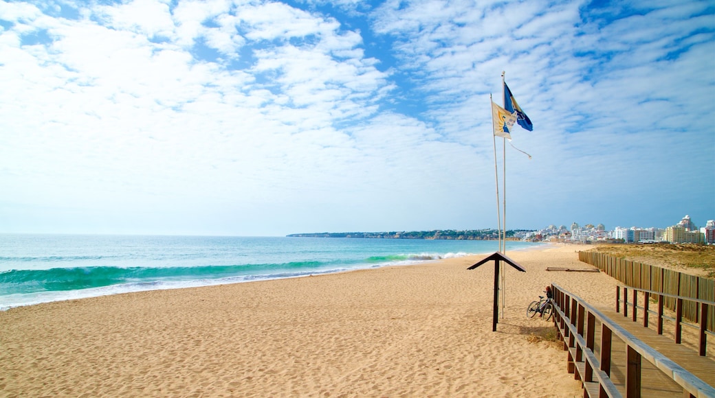 Salgados Beach showing general coastal views, waves and a beach