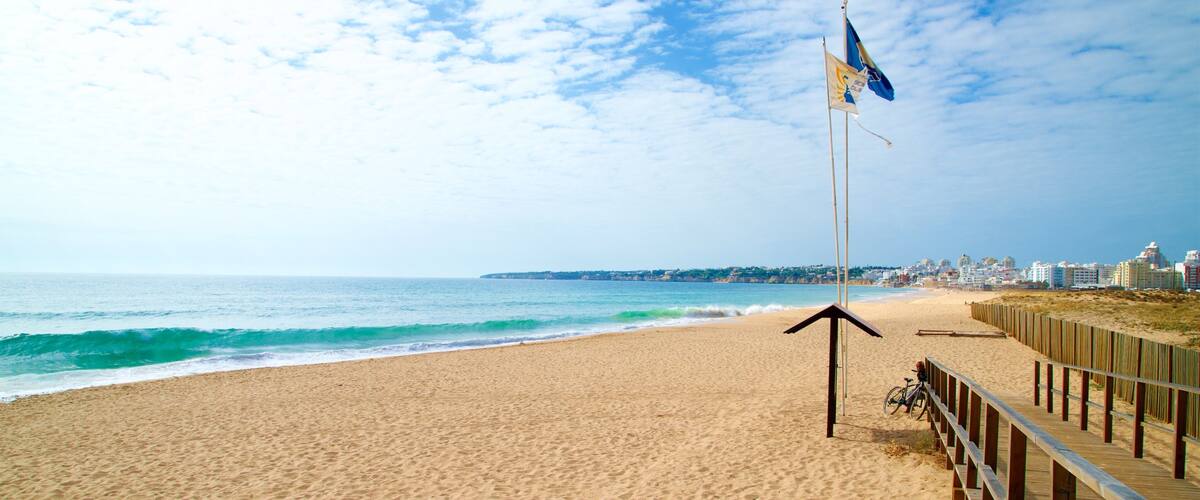 Salgados Beach showing general coastal views, waves and a beach