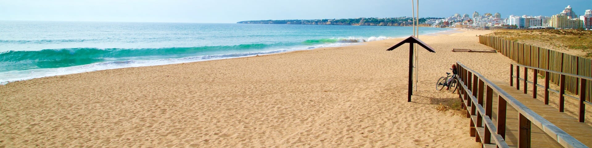 Salgados Beach showing general coastal views, waves and a beach