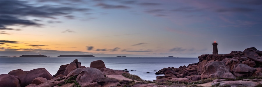 Panorama of the lighthouse of Ploumanach at sunset in Perros-Guirec, Côtes d'Armor, Brittany, France