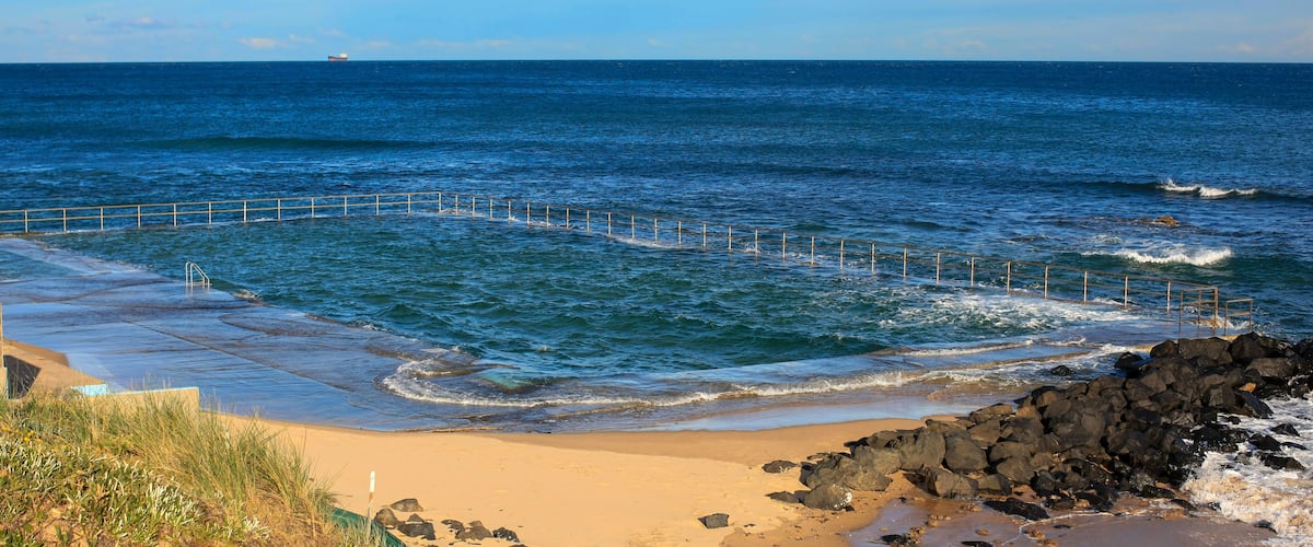 Towradgi Rock Pool north of Wollongong, NSW, Australia. Artificial swimming pool created amongst rocky outcrop of Pacific Ocean.
