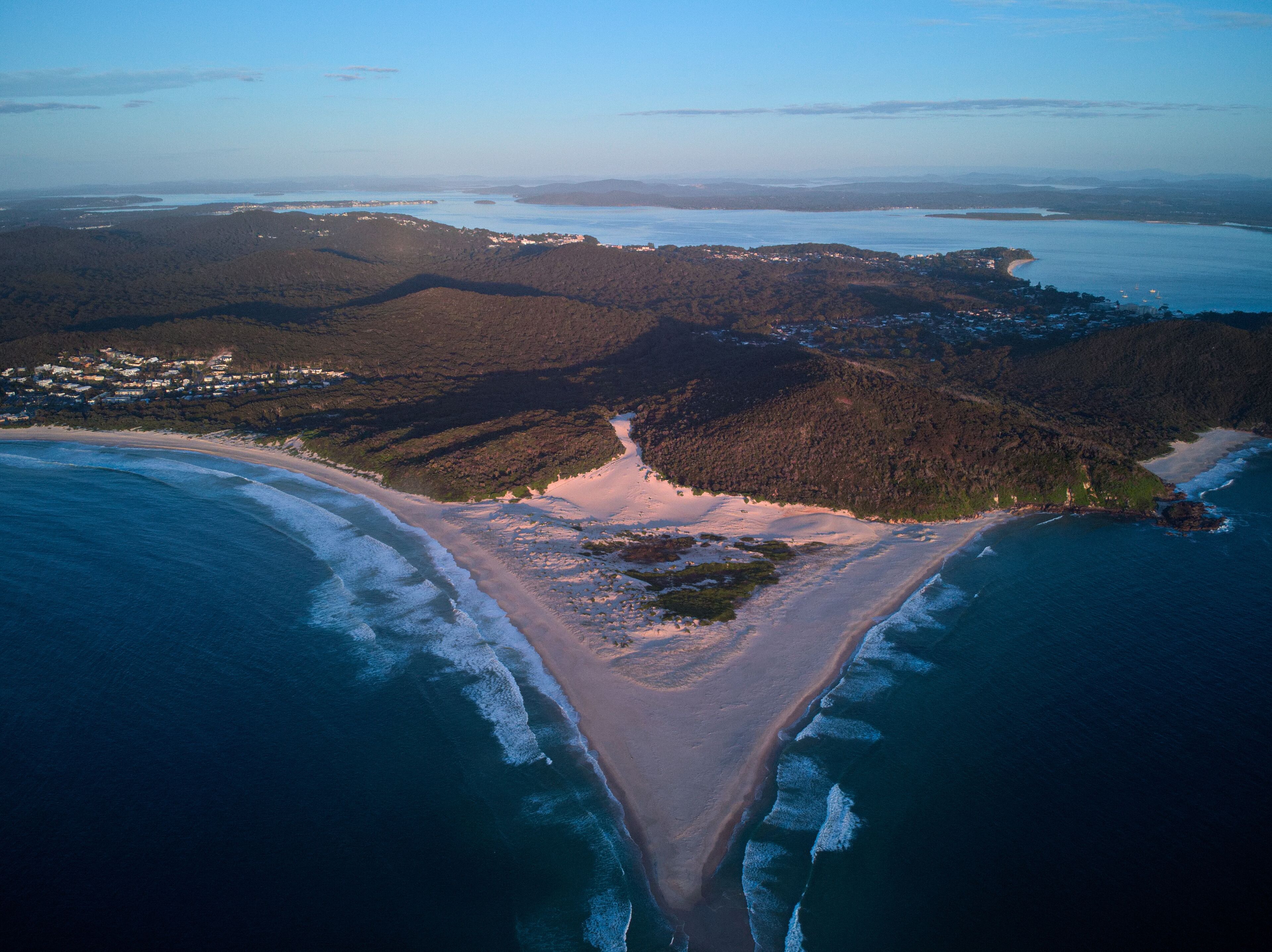 Drone photo of Fingal Bay taken from the Fingal spit, just before sunrise