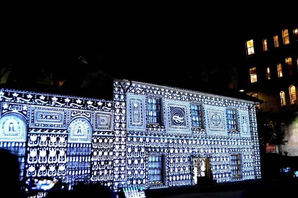 A building illuminated with intricate patterns and designs.