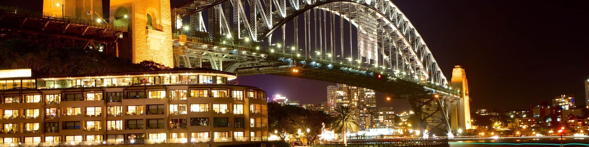 Circular Quay - The Rocks showing a bridge, a bay or harbour and a city