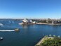 The Sydney Opera House with the Sydney Harbour Bridge in the background.