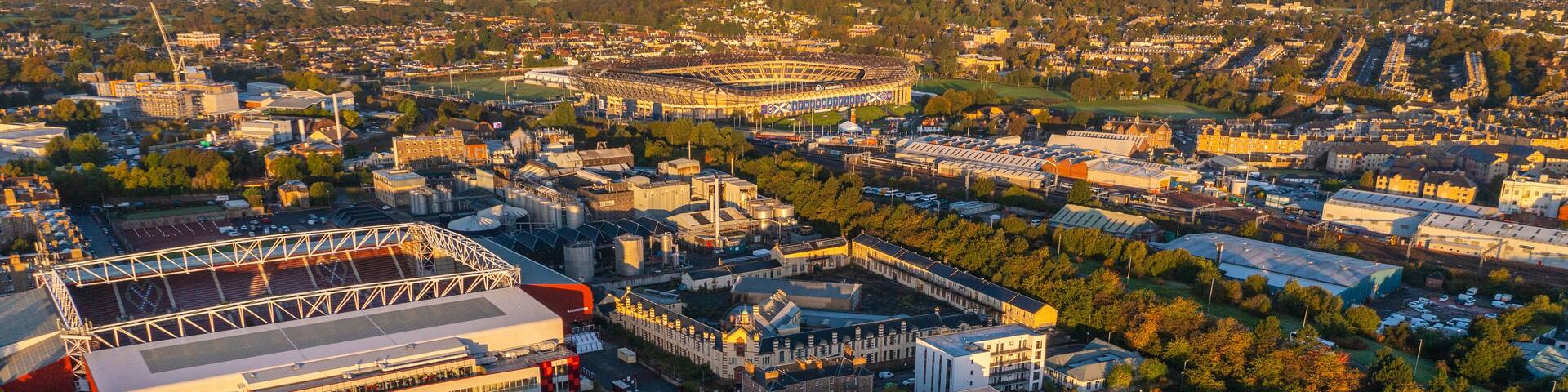 Aerial view of sunset over Murrayfield International Stadium and residential neighborhood in Gorgie, Edinburgh, Scotland, United Kingdom.