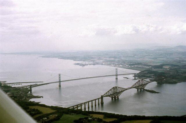The Forth Bridges, 1973 A view looking northwestwards from over Dalmeny, with Rosyth Dockyard in the misty middle distance on the other side of the Firth of Forth.