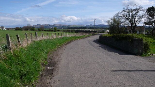 Turnhouse Farm Road Approaching Turnhouse Road. The Pentland Hills are visible in the distance.