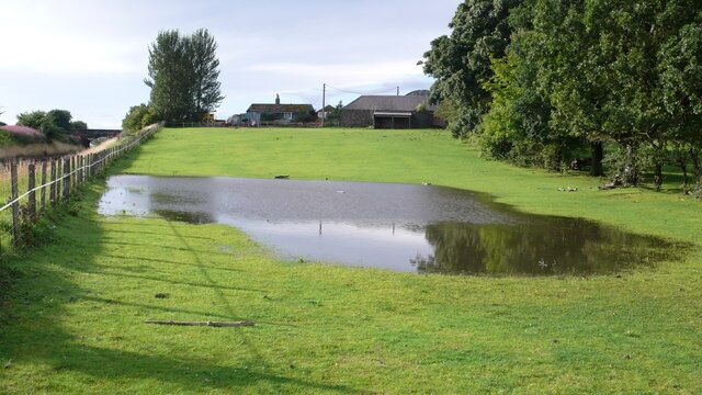 Flooded field, Turnhouse Farm July and August were very wet in Lothian. The fence marks the edge of the Edinburgh-Fife railway line.