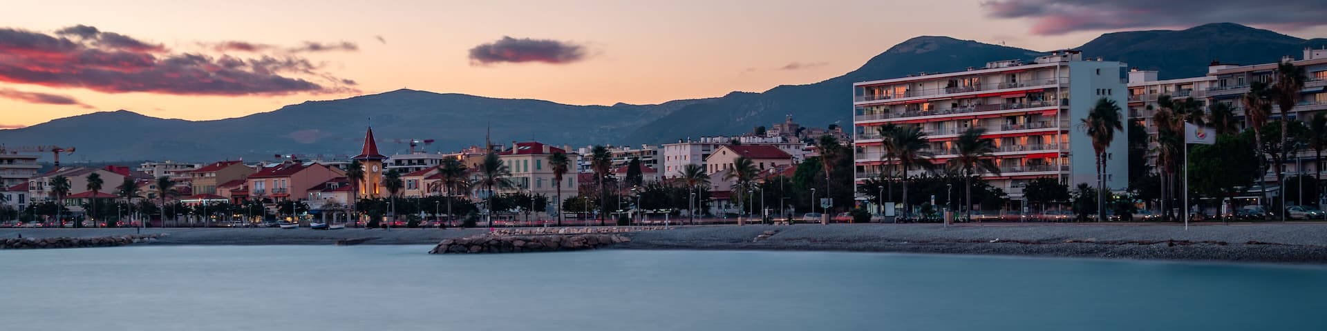 Romantic evening view of the French Riviera coastline from the Port of Cros-de-Cagnes.