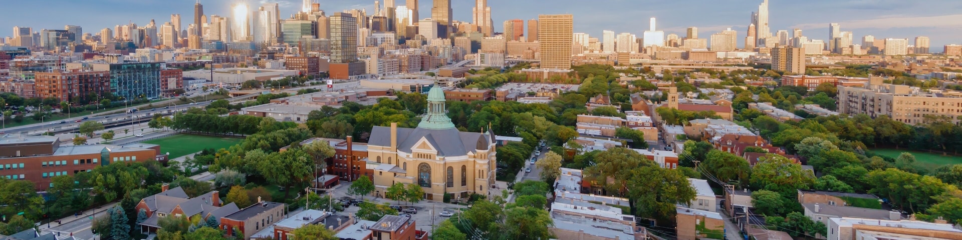 Chicago cityscape at sunrise, showing residential buildings and the city skyline. Urban landscape. University Village - Little Italy, Chicago, Illinois, United States Of America