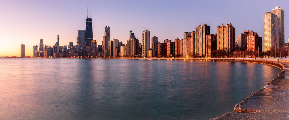 Panoramic view of Chicago skyline at sunrise.