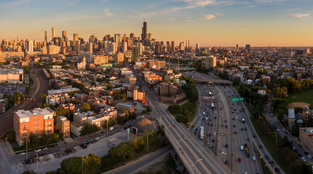 Chicago cityscape at sunset, showing the city's diverse architecture and busy highway traffic. Urban sprawl and transportation infrastructure. Goose Island, Chicago, Illinois, United States