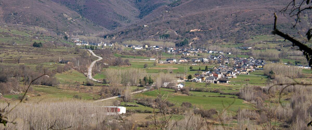 A valley with a small town nestled among hills.