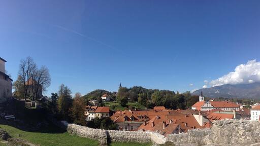 Kamnik is a small medieval town around 20 km north-east of Ljubljana. There are a couple of castles here, and the town is surrounded by mountains. Very beautiful.
Train is €2.58 each way; takes 40 minutes
