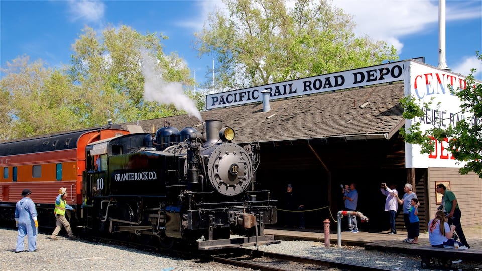 A steam locomotive at a Pacific Rail Road Depot.