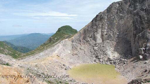 This volcano is active with steam vents and hot springs. However, it has not errupted since 1881. You can take a public bus to the bottom of the park and then walk to the peak. The majority of the way up is on a paved road - which totally sucks in my opinion - but then you get to the base camp where the road ends. Continue on the path up to the top and explore away! We spent between 2-3 hours once we reached the top, climbing different areas and so on. The view of Mt. Sinabung is incredible, especially since it was erupting while we were here. You can take a different way down, ending by hot springs in a small town, which is much nicer than the way up.