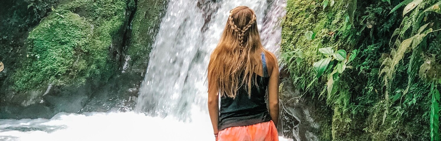 I love the mountains, but exploring the rainforests in Ecuador was just as beautiful. This was one of many waterfalls we discover on our hike, and just look at all that green!!