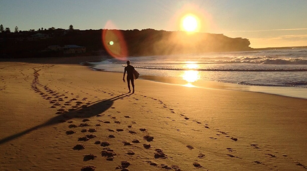 Curl Curl Beach is on Sydney's North Shore. You can walk along the boardwalk from the south and then over the headland to the north. There's good surf and a surf club at the north end. You'll find a coffee shop at the south end of the beach. This beach is much less crowded than nearby spots such as Manly