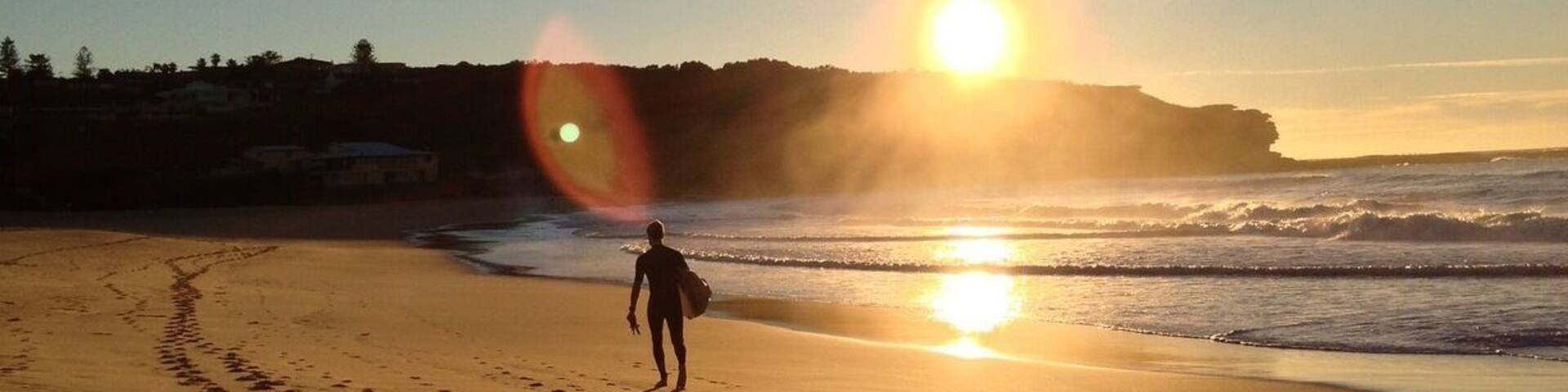 Curl Curl Beach is on Sydney's North Shore. You can walk along the boardwalk from the south and then over the headland to the north. There's good surf and a surf club at the north end. You'll find a coffee shop at the south end of the beach. This beach is much less crowded than nearby spots such as Manly