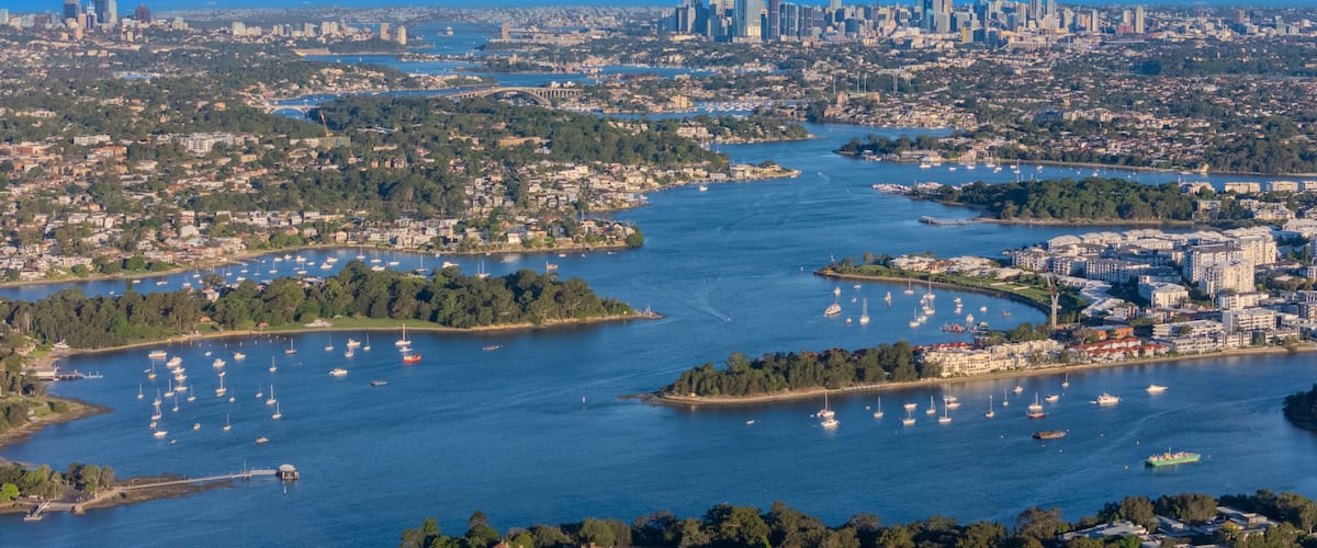 Panorama Aerial view above Rhodes with views to Meadowbank and Olympic park and Wentworth Point and Concord West with Parramatta River in Sydney NSW Australia