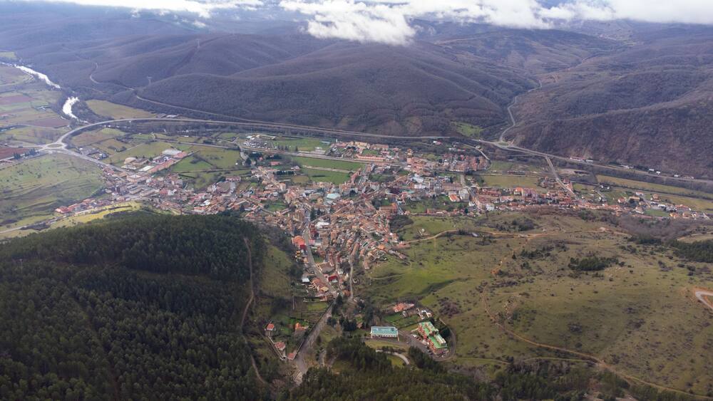 Cistierna, spain, surrounded by mountains and forests, seen from above