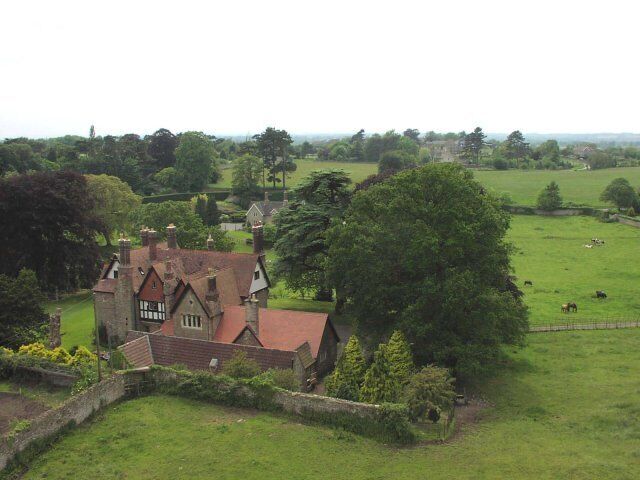 View from the top of the tower of Wickwar Church. The walls around the house are the remains of a Saxon walled settlement.