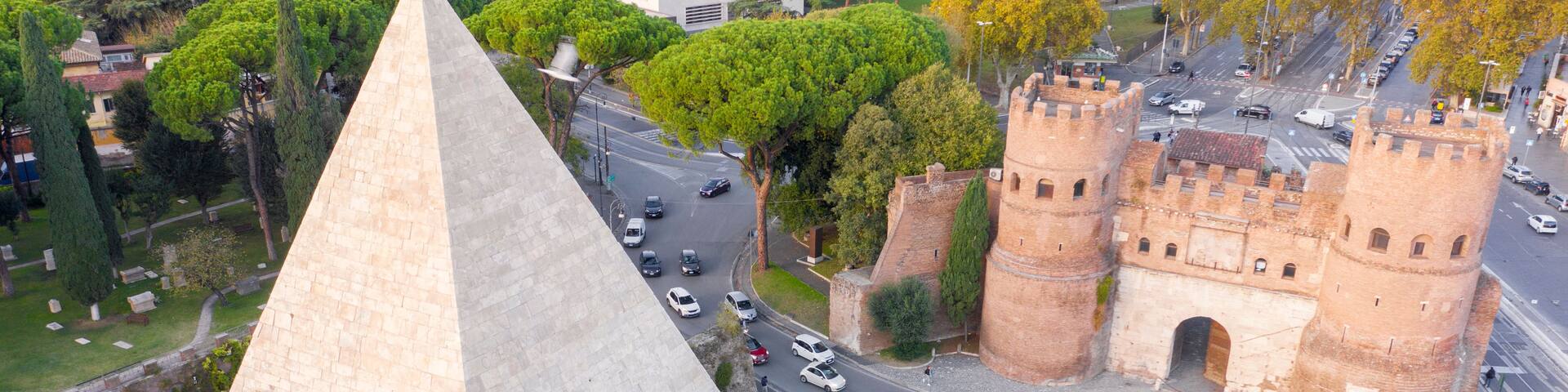 Aerial view of Ostiense square and Pyramid of Cestius, a Roman Era pyramid located in Rome, Italy.