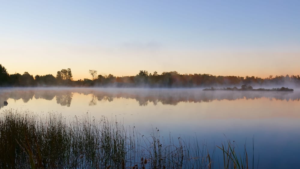 Picturesque Williamstown lake at misty dawn Lakeville New Brunswick Canada