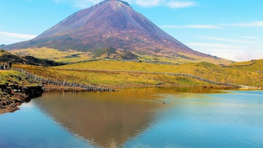 A mountain with a lake in the foreground.