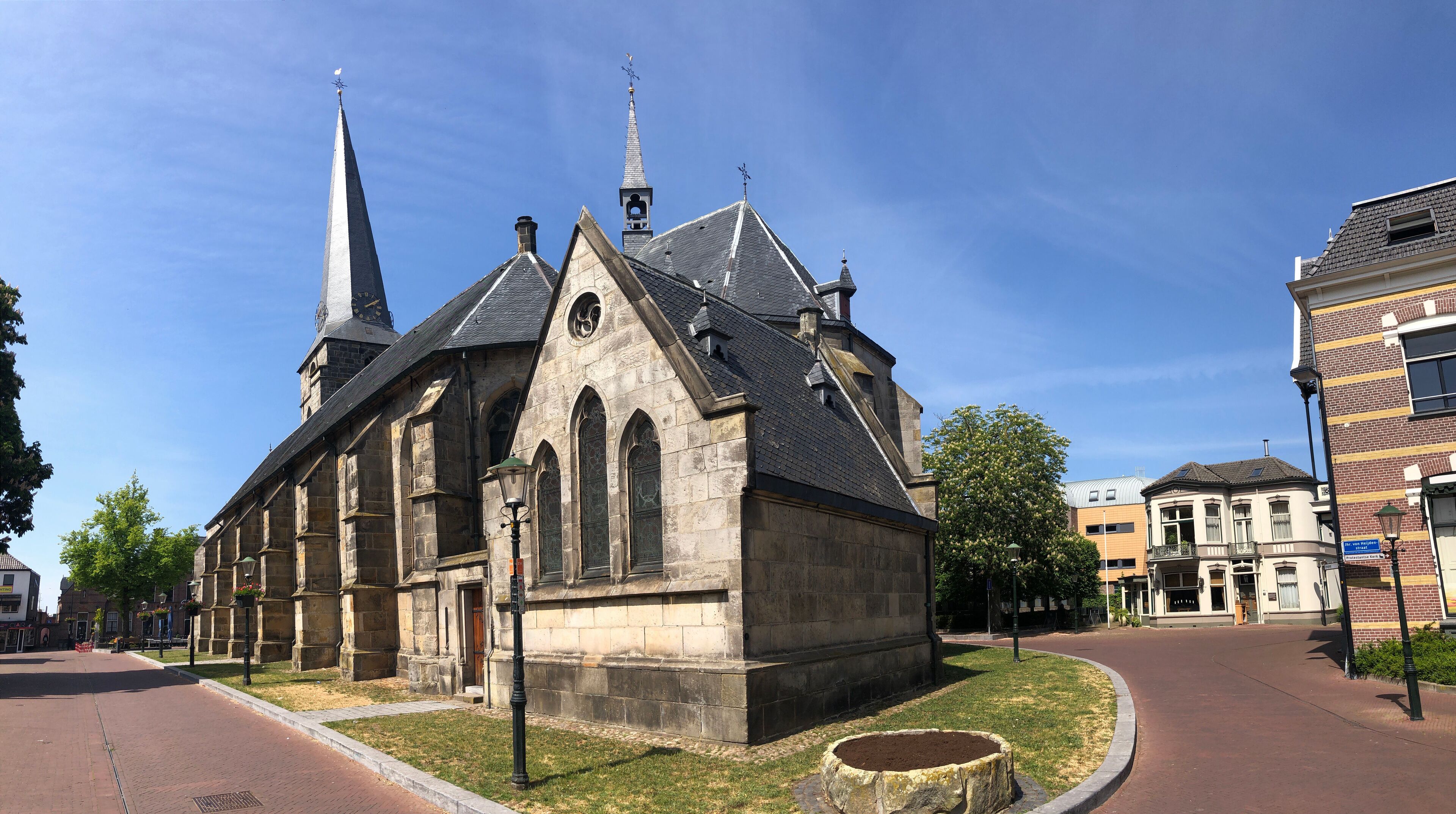A historic church with a tall steeple and a clock tower.