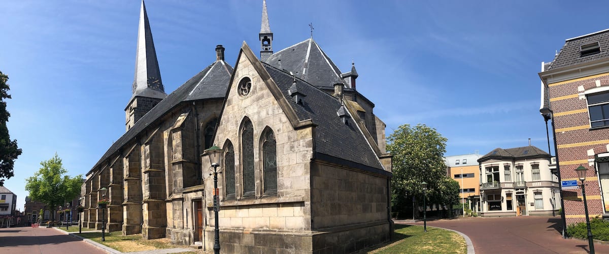 A historic church with a tall steeple and a clock tower.