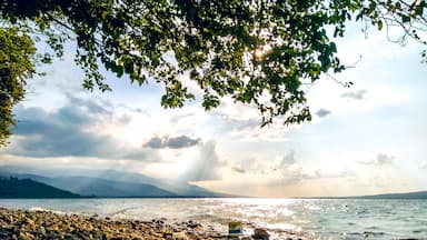 A wavy lakeside view of Sapanca Lake with dramatic light and sky.