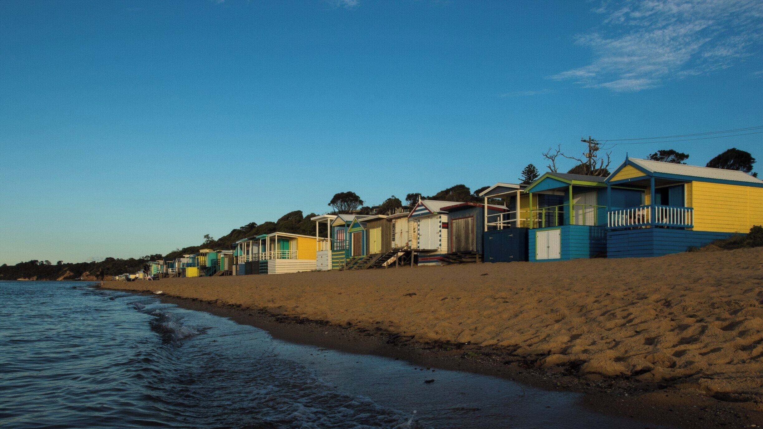 A big feature of the beaches that line the eastern shorelines of Port Phillip Bay in Victoria are the brightly coloured beach bathing boxes. Mount Martha has some spectacular examples of these curious structures. And there is nothing like a sunset on the beach.
