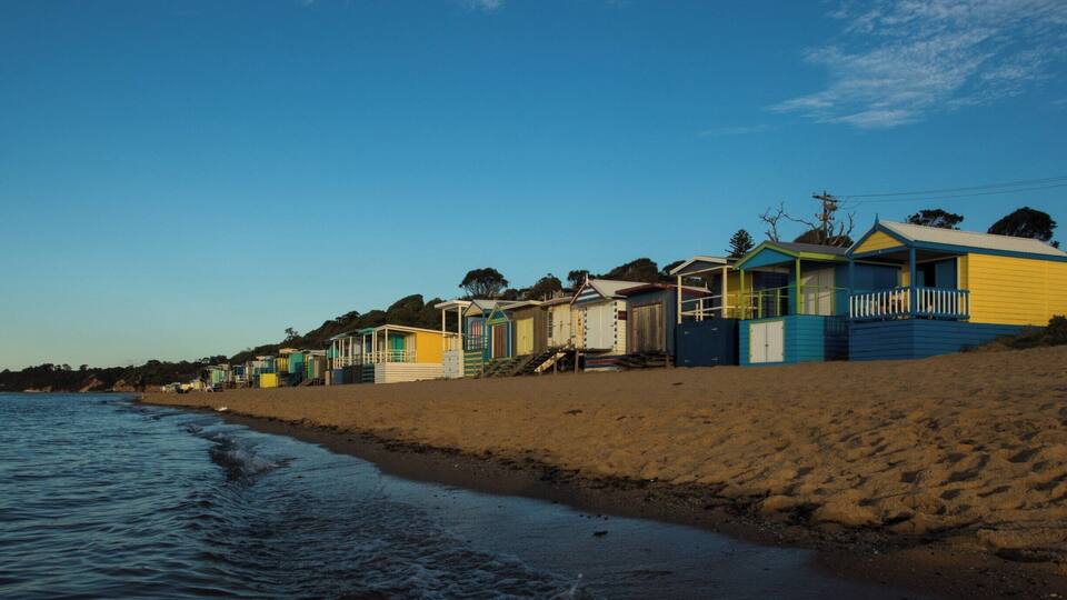 A big feature of the beaches that line the eastern shorelines of Port Phillip Bay in Victoria are the brightly coloured beach bathing boxes. Mount Martha has some spectacular examples of these curious structures. And there is nothing like a sunset on the beach.